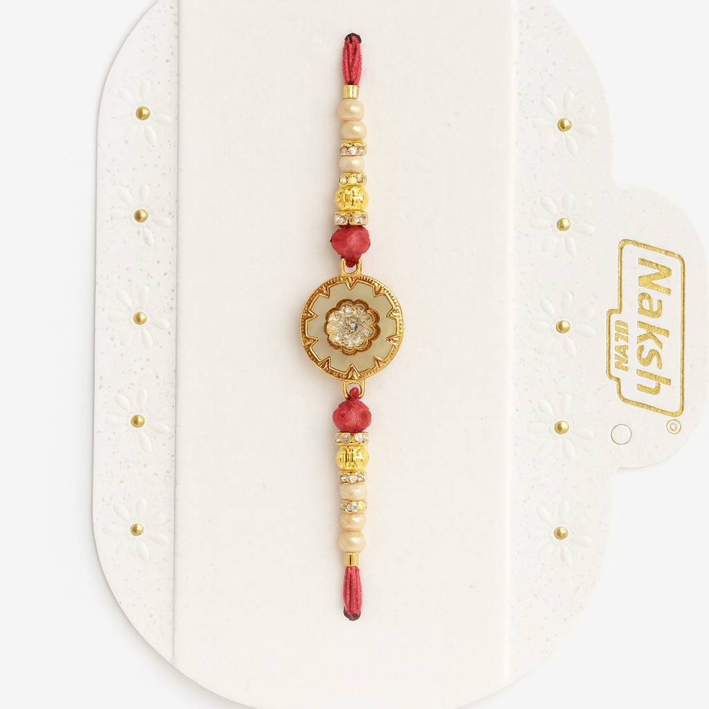 Designer Rakhi With Gold And Red Beads