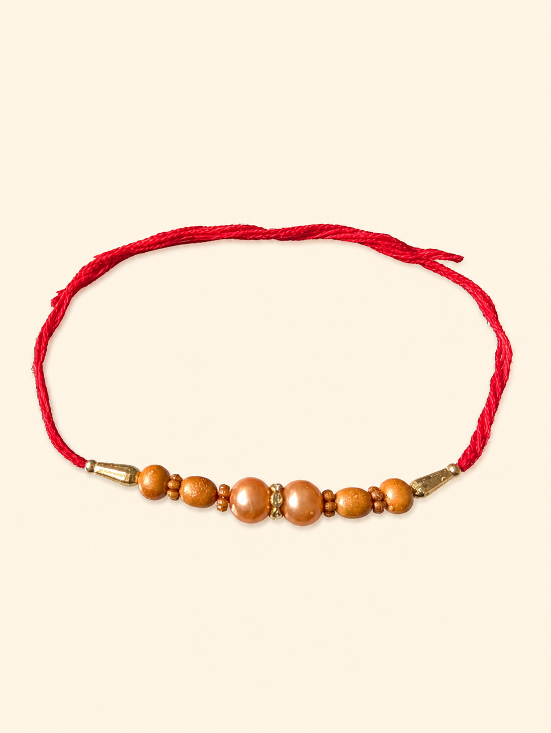 Golden Beads Dhaga Rakhi with Red Thread